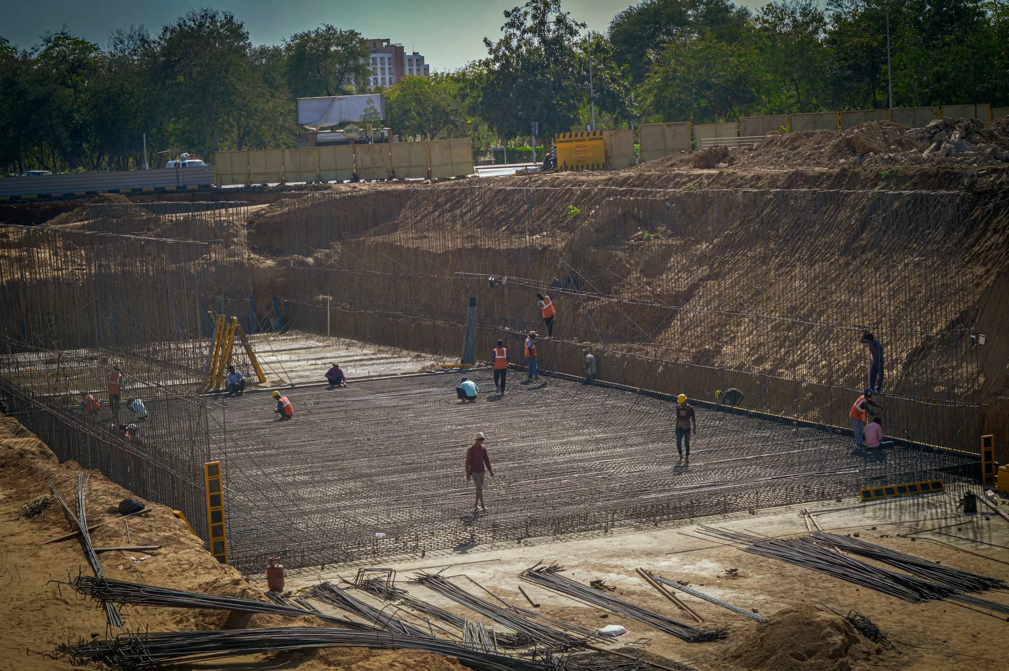 Rebar mat laid out in a large foundation excavation